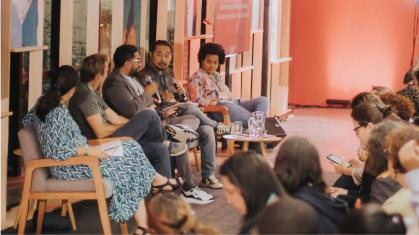 Panelists sit on stage to share perspectives on education and racial equity at the annual GIFE Congress