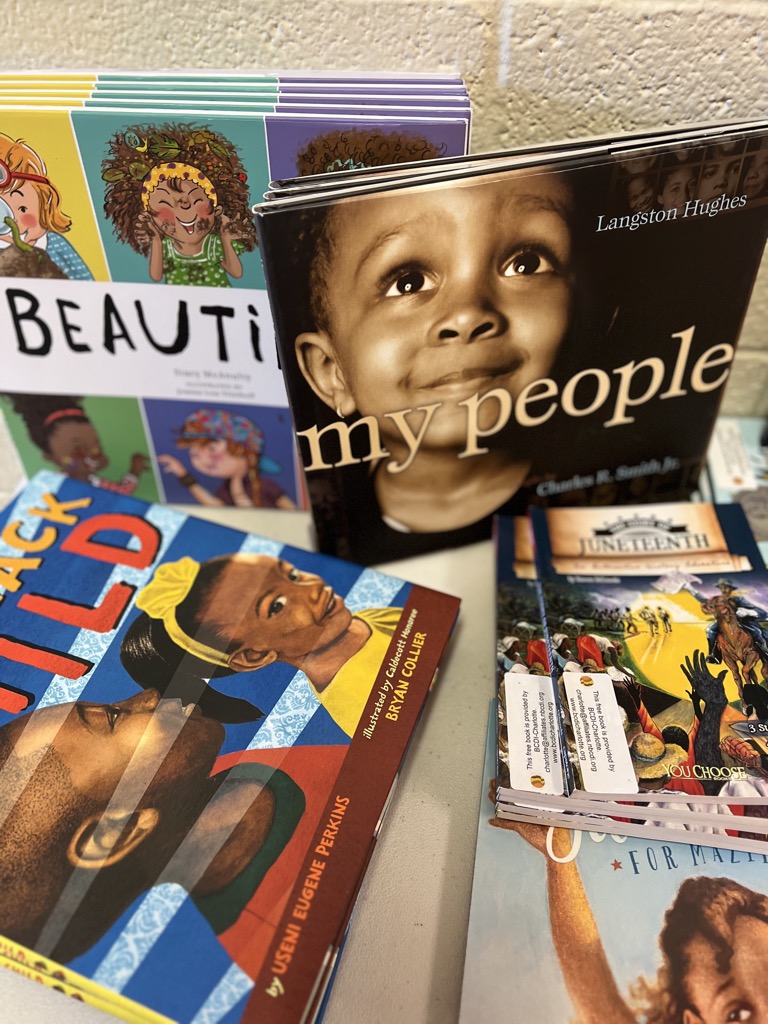 A stack of children's books celebrating the beauty and history of the Black American community. 